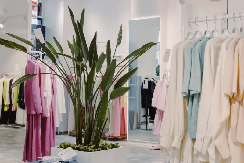 Bright apparel boutique with clothing racks