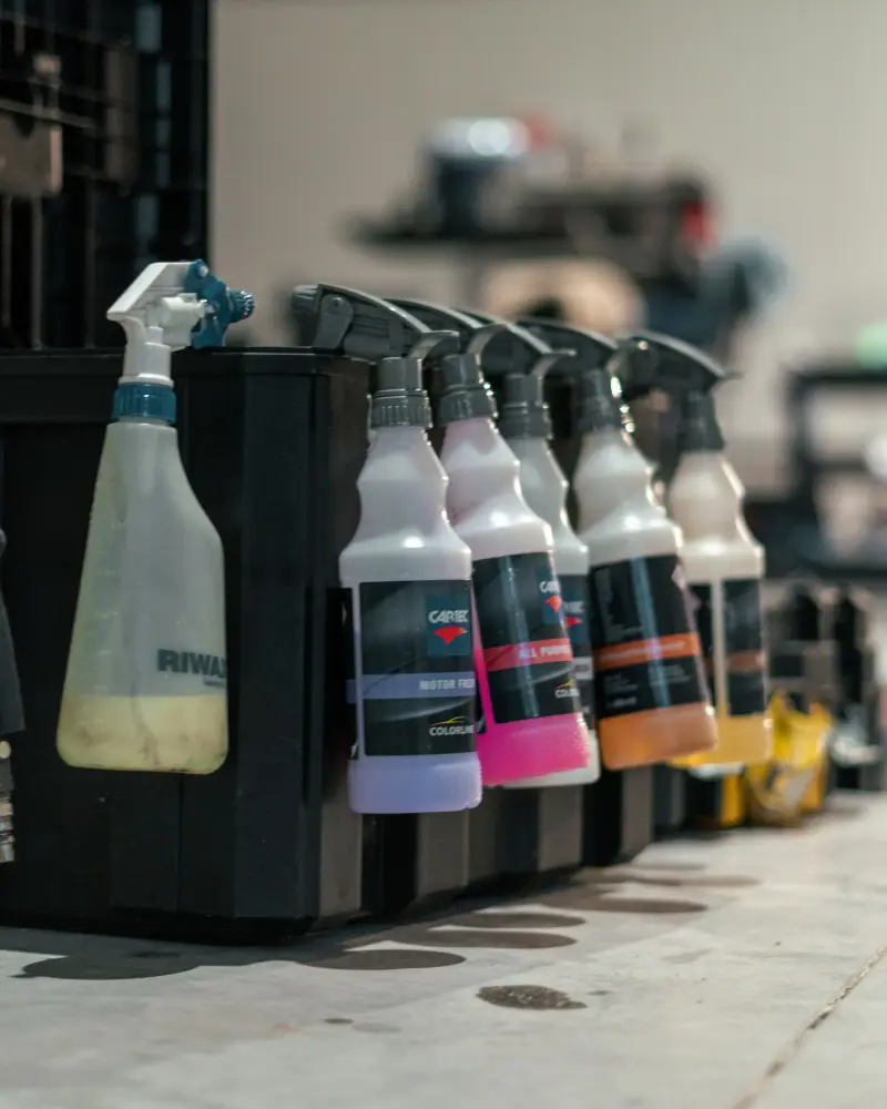 Car care spray bottles on a shelf