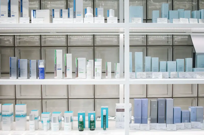 Skincare products on white retail shelves