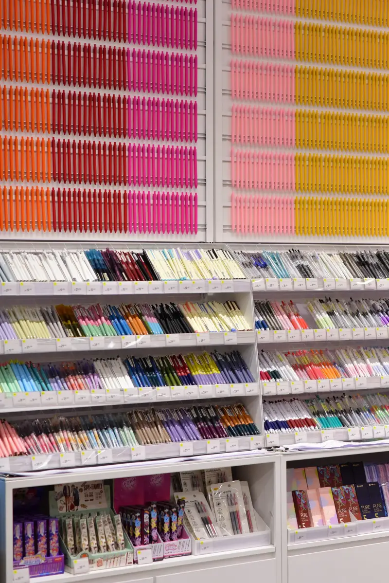 Pens and writing instruments on display in a stationery store