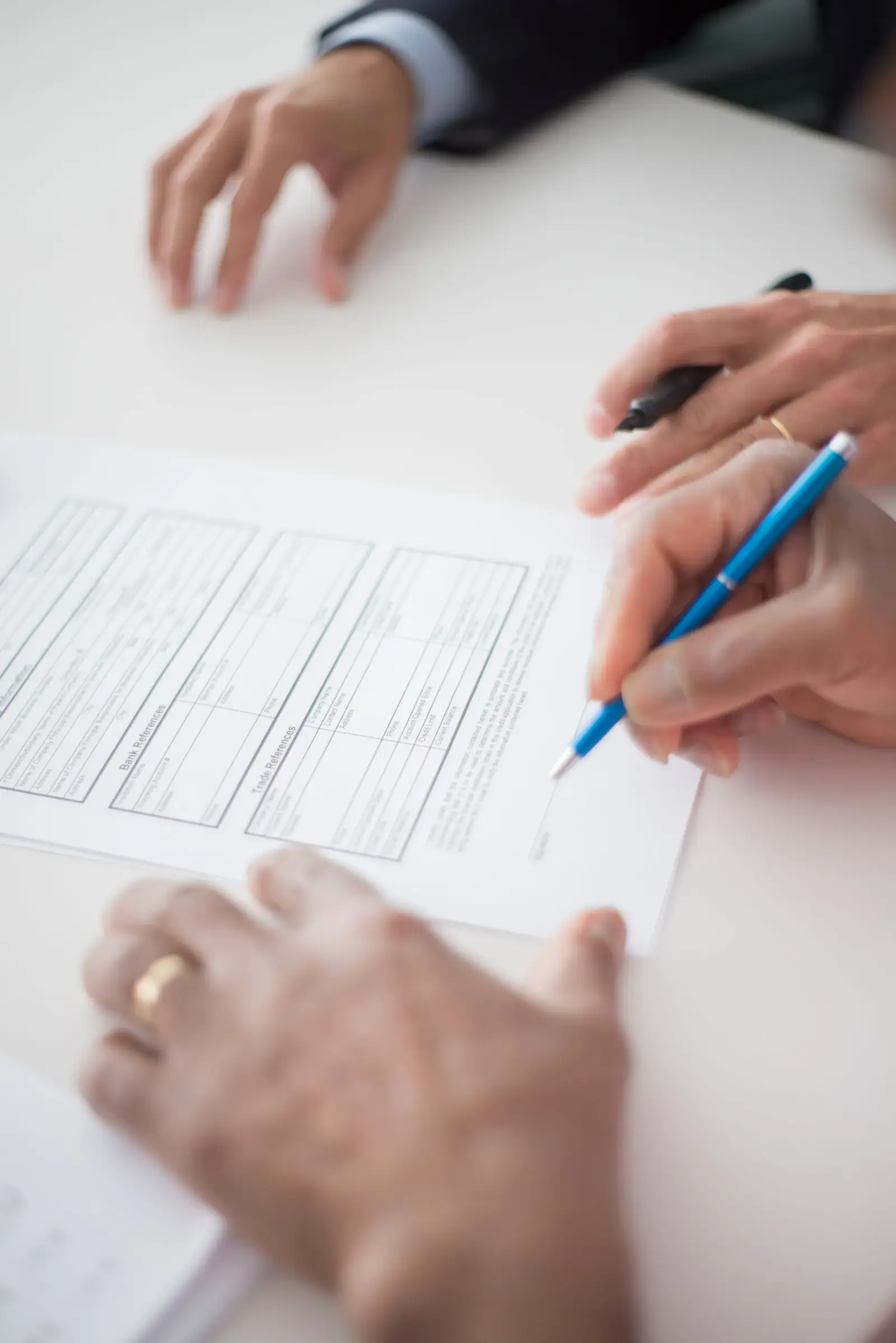 Hand signing a business agreement